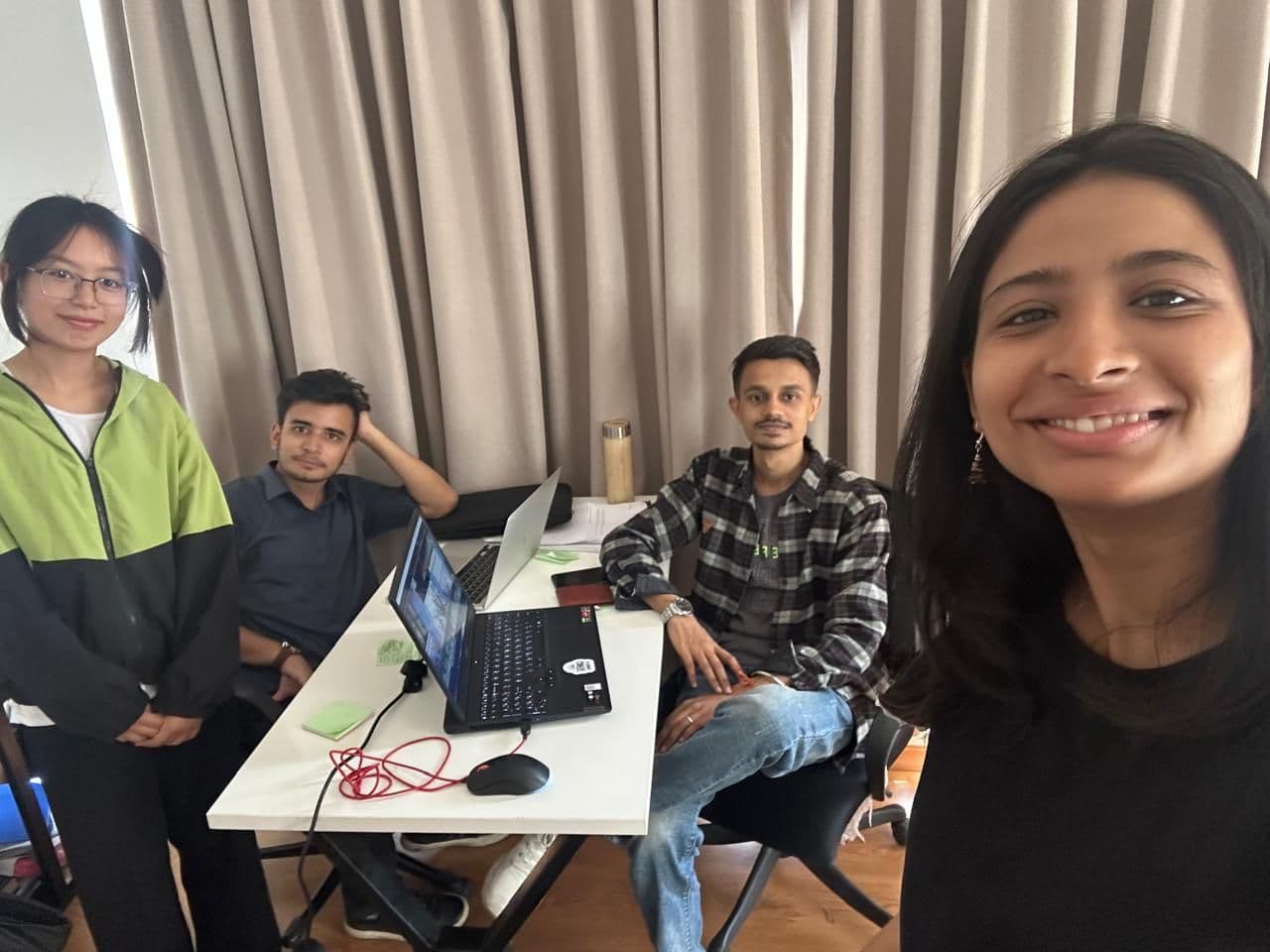 A working session, laptops open on the table